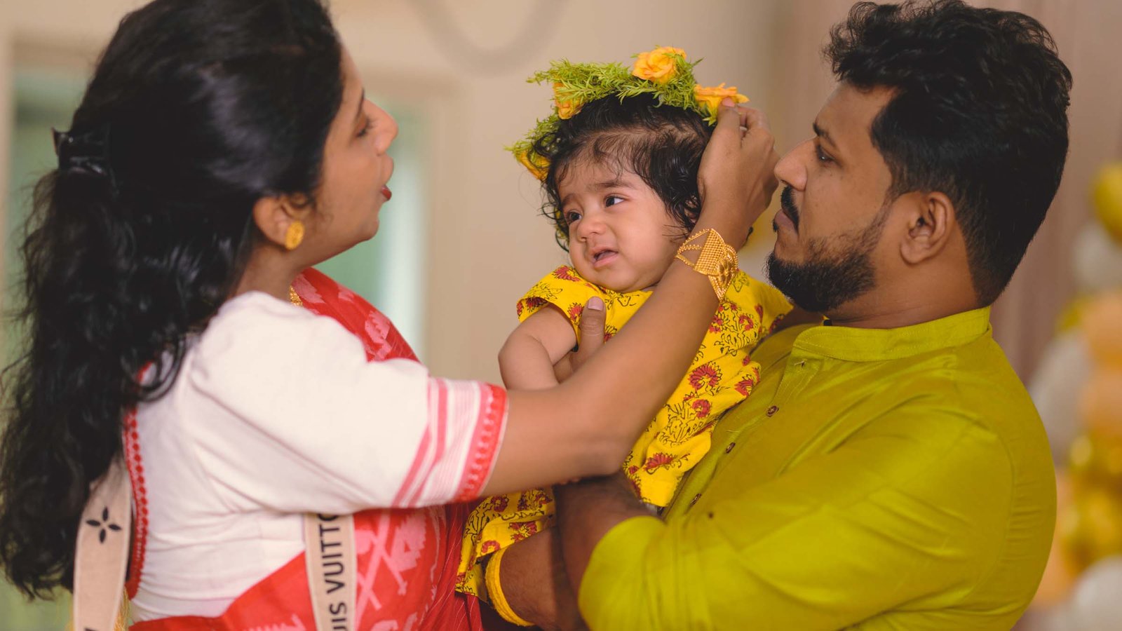 Family feeding baby — Annaprashan ceremony