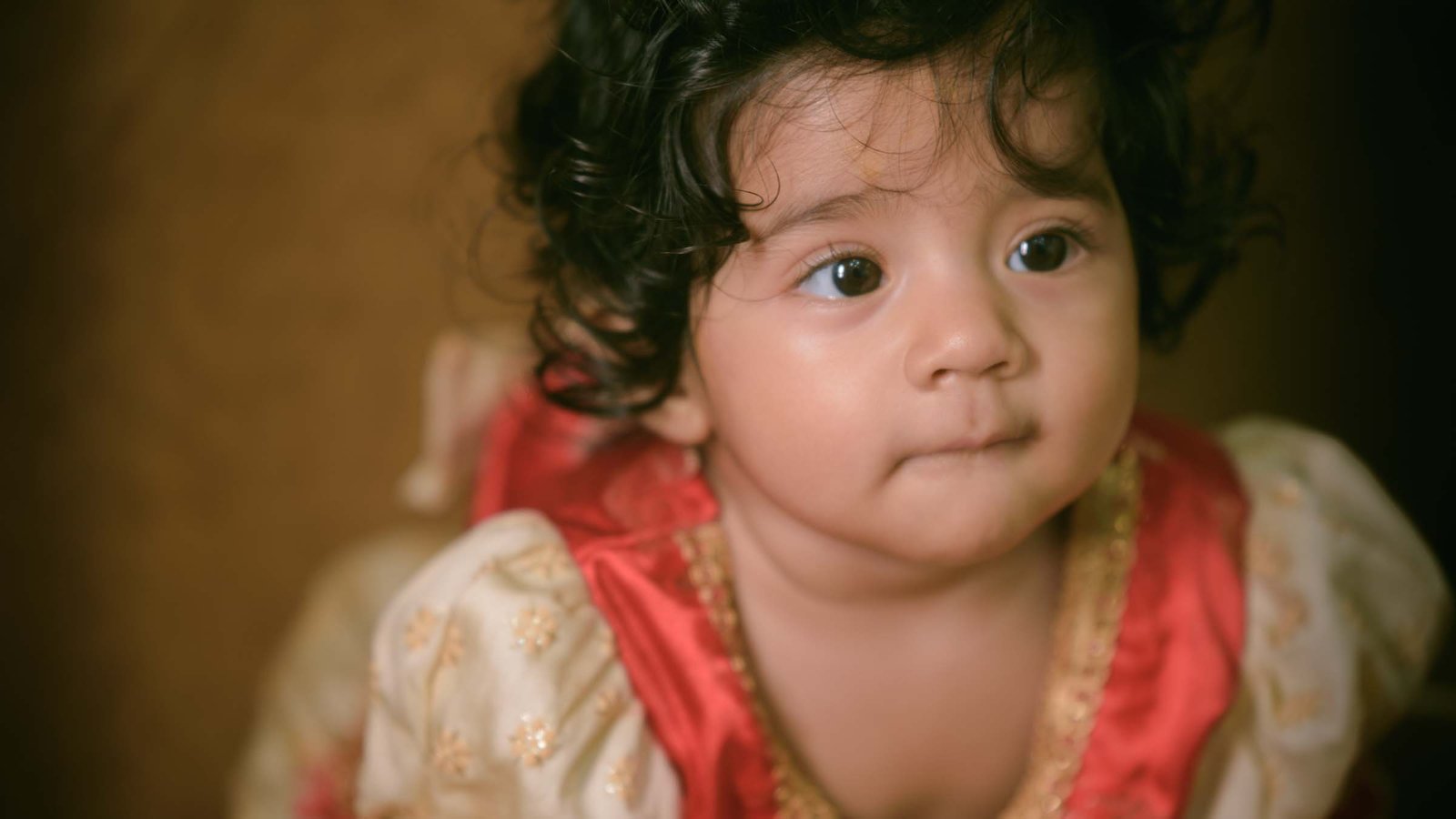 Grandparents blessing baby at Annaprashan