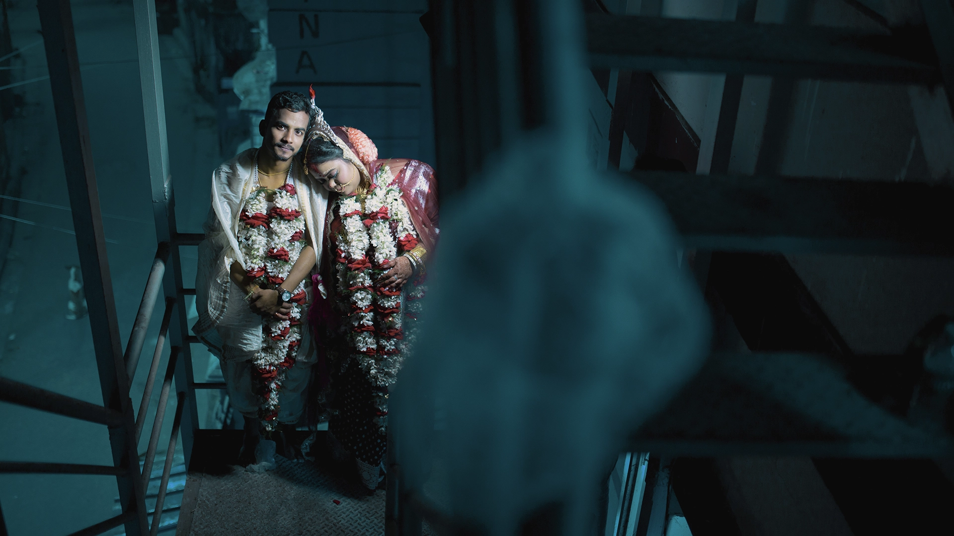 Cinematic wedding photography in Kolkata by Roy's Studio featuring dramatic lighting and rich color grading