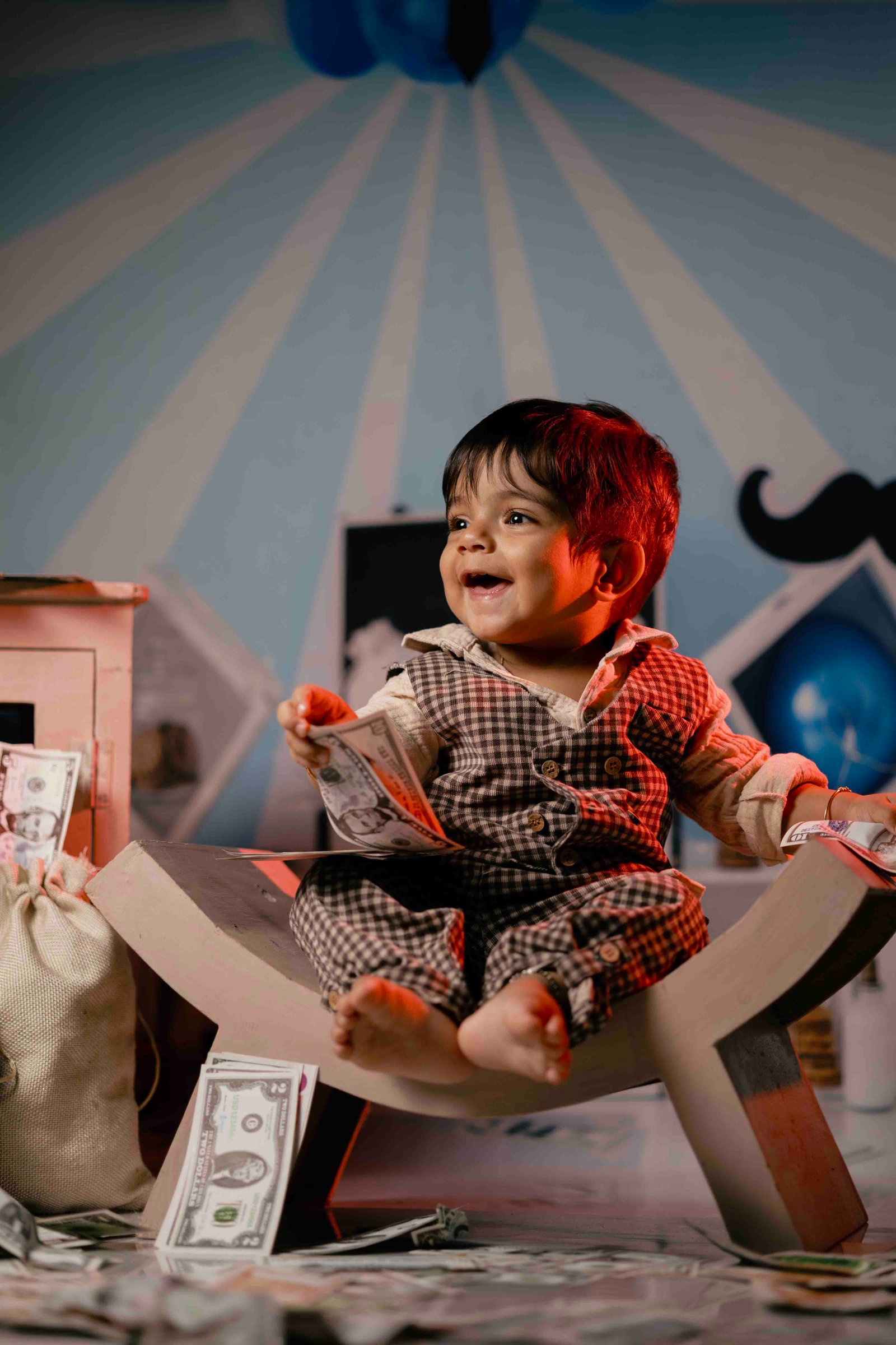 Baby crawling on a festive setup during milestone photography